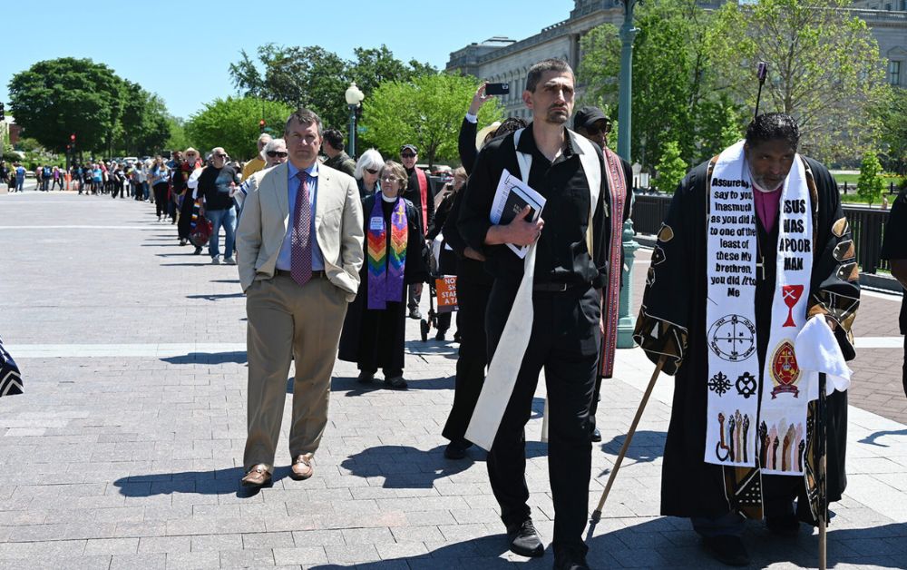 The Rev. William Barber II, from right, and the Rev. Jonathan Wilson-Hartgrove lead a procession from a Moral Monday rally to the Capitol, Monday, April 28, 2025, in Washington. (RNS photo/Jack Jenkins)